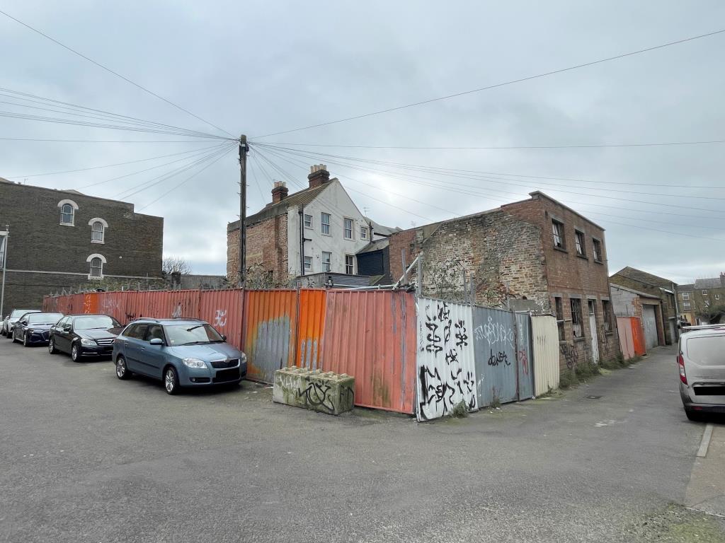 Lot: 72 - SITE WITH PLANNING FOR FIVE HOUSES IN TOWN CENTRE - View of site from Bellevue Avenue